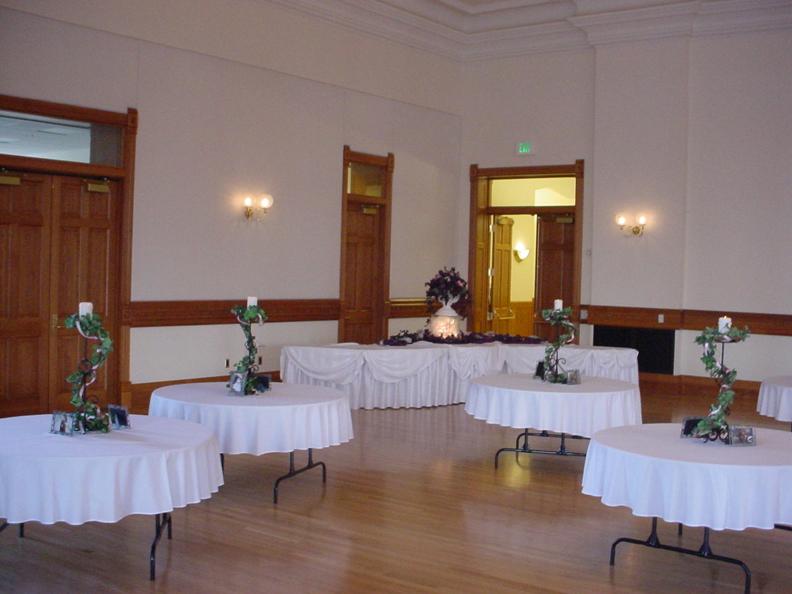 Round tables with centerpieces in the Ballroom at Provo Library